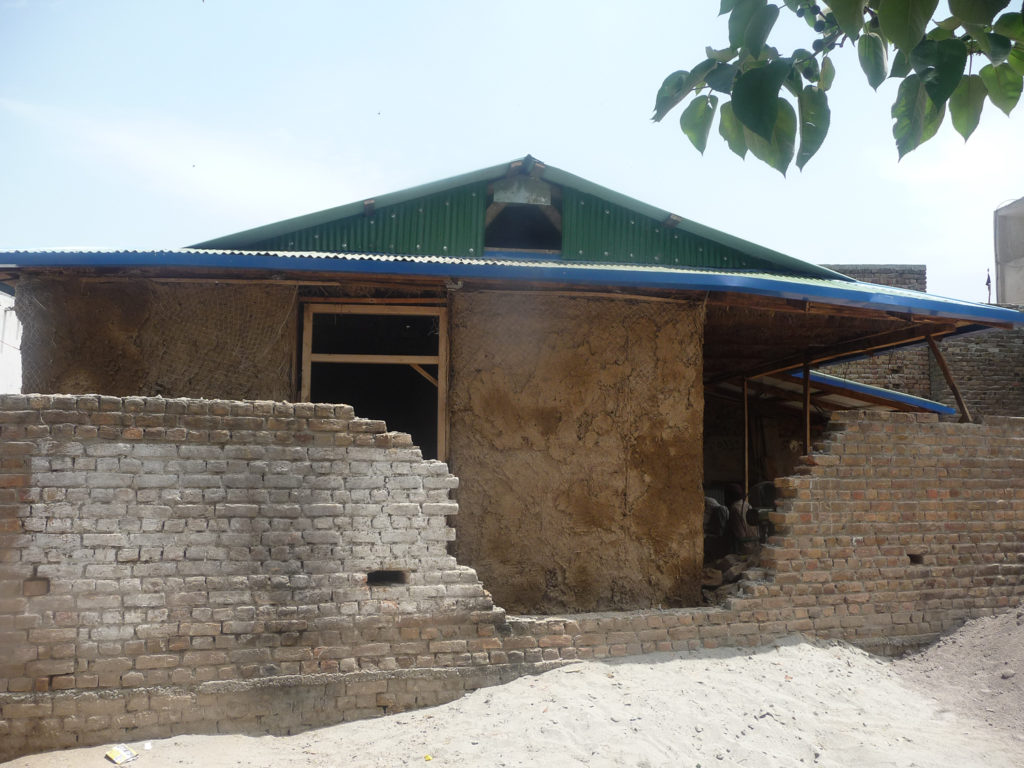 Saleem house - earthen plaster is applied